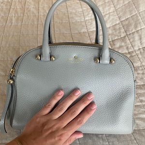 Light Blue Kate Spade brand purse with gold zippers and dust bag